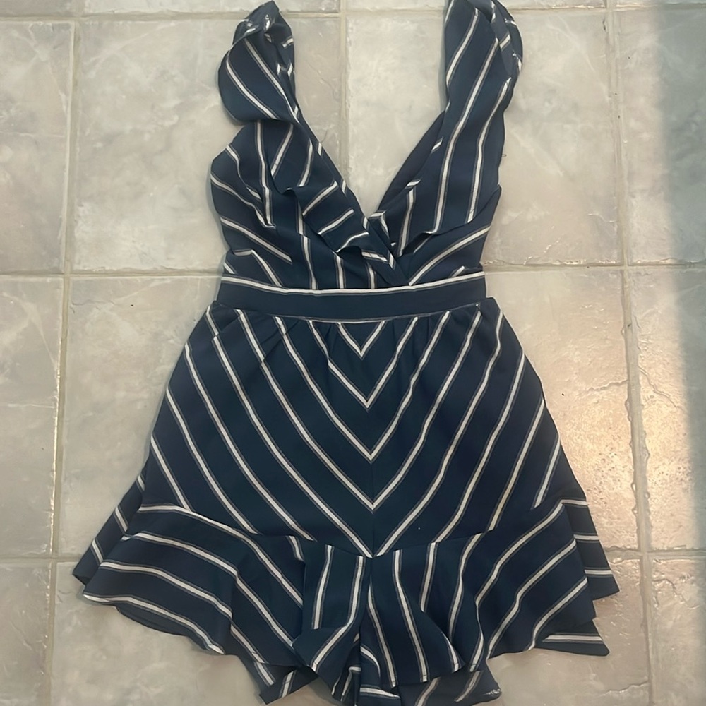 Blue and white striped romper. Adjustable straps open back with tie